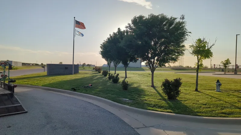 American flag and a fresh mown field